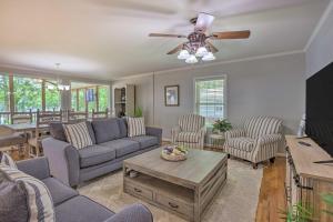 a living room with a couch and a ceiling fan at The Lake Escape Boat Dock, Paddle Board, Kayak! 