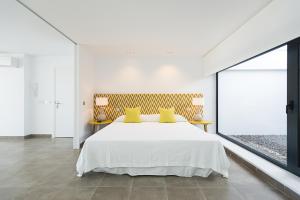 Postel nebo postele na pokoji v ubytování Altos de la Gloria Beach Apartments