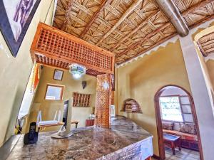 a home office with a stone counter in a room at Guest House Defat Kasbah in Aït Benhaddou +23 photos