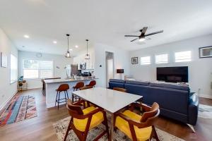 a living room with a table and a couch at Downtown Jewel in Wilmington