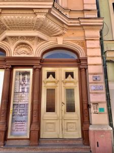 a building with two doors on the side of it at Silver Dawn Apartments in Szeged