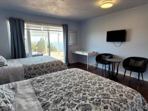 HOV B&B House -Hospitality Ocean View Victoria- tesisinde bir odada yatak veya yataklar