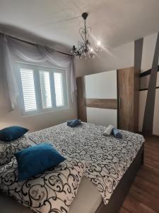 A bed or beds in a room at Apartments Rezek