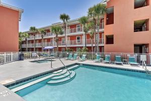 a swimming pool in front of a apartment building at Gulfview II 301 in Destin