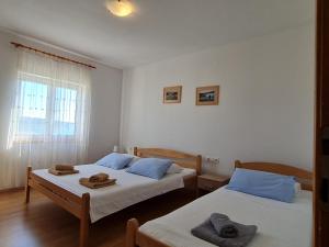 Apartments Zakarija客房内的一张或多张床位