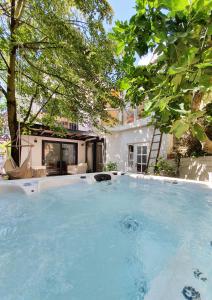 a large swimming pool in front of a house at Alte Goldschmiede Südpfalz in Klingenmünster