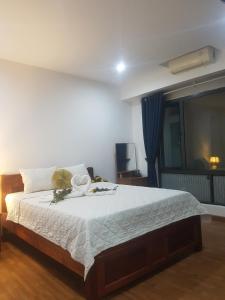 Ένα ή περισσότερα κρεβάτια σε δωμάτιο στο Hanoi View Legend Hotel