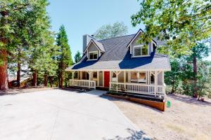a house with a driveway in front of it at Tree-Top Getaway in Lake Arrowhead