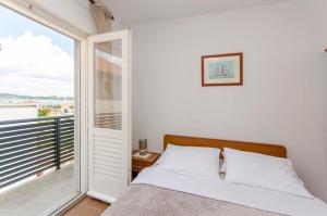 Кровать или кровати в номере Apartments and Rooms Mare
