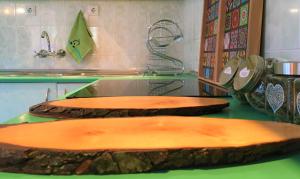 a kitchen with three wooden cutting boards on a counter at Dimitrovi Guesthouse - Peaceful Stay near Beach with Garden, Sarafovo in Burgas +54 photos