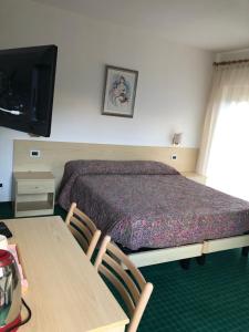 Кровать или кровати в номере Garnì Mariolina