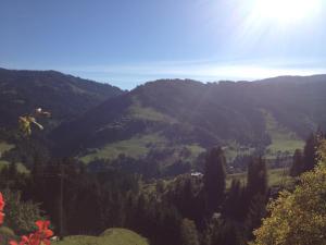 a view of a mountain with the sun shining on it at Bauernhof Bachgut in Mühlbach am Hochkönig