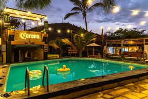 a swimming pool with a rubber duck in a raft at Hotel Punta Ballenas in Máncora