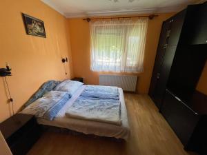 Posteľ alebo postele v izbe v ubytovaní Csillám vendégház