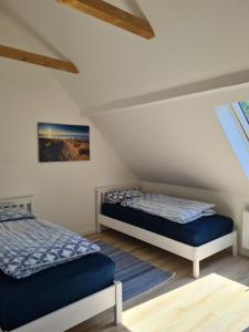Postel nebo postele na pokoji v ubytování Leuchtturm Emden
