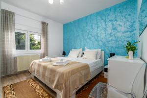Ein Bett oder Betten in einem Zimmer der Unterkunft Dijamant Apartment