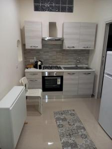 Kuchyň nebo kuchyňský kout v ubytování Il Sorriso Casa Vacanze