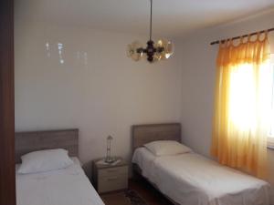 Postel nebo postele na pokoji v ubytování Apartment Bise