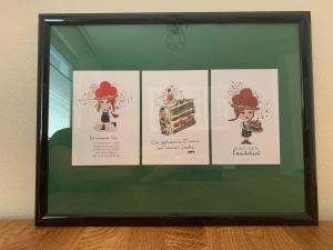 a framed picture of four illustrations of a cake at Schwarzwaldmarie in Bühl