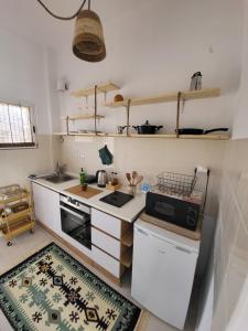 A kitchen or kitchenette at Viva La Veranda Apartment in Central Athens