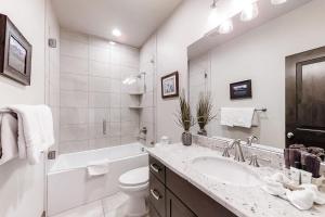 a white bathroom with a sink and a toilet at West Wintercress Dream in Heber City +21 photos