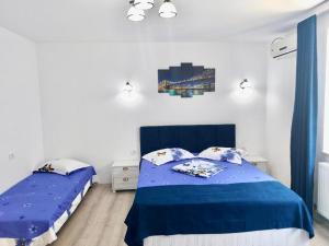 Postel nebo postele na pokoji v ubytování Vila Coty
