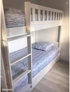 a white bunk bed in a small room at Perle bleue in Vic-la-Gardiole