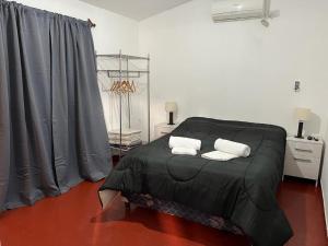 Postel nebo postele na pokoji v ubytování Depto Tres Cerritos