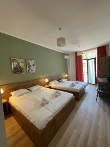 Postel nebo postele na pokoji v ubytování Villa Flora