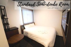 Cama o camas de una habitación en Henn na Hotel Tokyo Akasaka