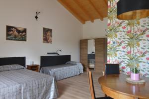 Postel nebo postele na pokoji v ubytování Agriturismo Pepe Rosa + 35 fotografií