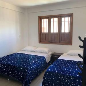 Postel nebo postele na pokoji v ubytování La Casa de Mamá Tere