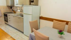 Kuchyňa alebo kuchynka v ubytovaní Planikovica Apartments