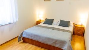 Posteľ alebo postele v izbe v ubytovaní Planikovica Apartments