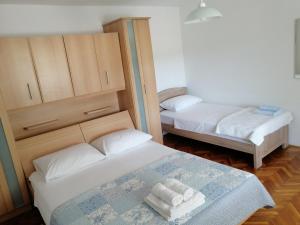 Postel nebo postele na pokoji v ubytování Holiday house Tunjarice