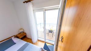 Posteľ alebo postele v izbe v ubytovaní Planikovica Apartments