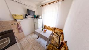 Kuchyňa alebo kuchynka v ubytovaní Planikovica Apartments
