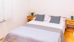 Posteľ alebo postele v izbe v ubytovaní Planikovica Apartments
