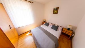 Posteľ alebo postele v izbe v ubytovaní Planikovica Apartments