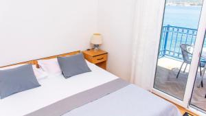 Posteľ alebo postele v izbe v ubytovaní Planikovica Apartments