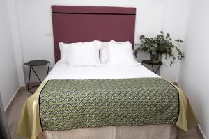 Cama o camas de una habitación en Azahar de Sevilla Apartments