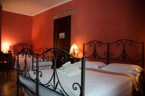 Säng eller sängar i ett rum på Bed and breakfast La Sentinella