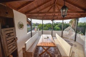 Posedenie v ubytovaní ALEXANDRE MAISON Beachfront Gialova Vacation Home