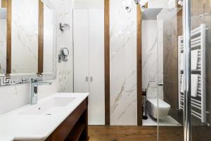 Kúpeľňa v ubytovaní ApartmentPrestige Central Station + 37 fotografií
