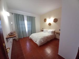 Postel nebo postele na pokoji v ubytování CASA RAMOS II