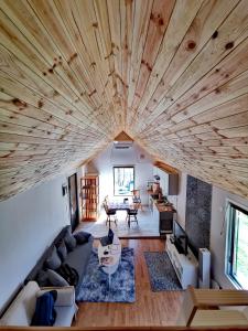 an overhead view of a living room with a large wooden ceiling at Dyreborg Boutique Guesthouse in Knäred