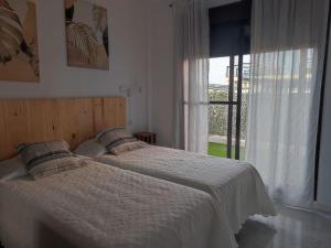 Postel nebo postele na pokoji v ubytování Apartment in Ayamonte with River Views + 32 fotografií