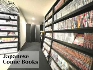 a japanese comic books are on display in a library at Henn na Hotel Tokyo Akasaka in Tokyo
