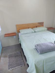 Ein Bett oder Betten in einem Zimmer der Unterkunft Flores do Cerrado