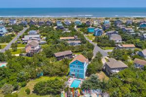 an aerial view of a residential neighborhood with a blue house at Happy Ours in Salvo